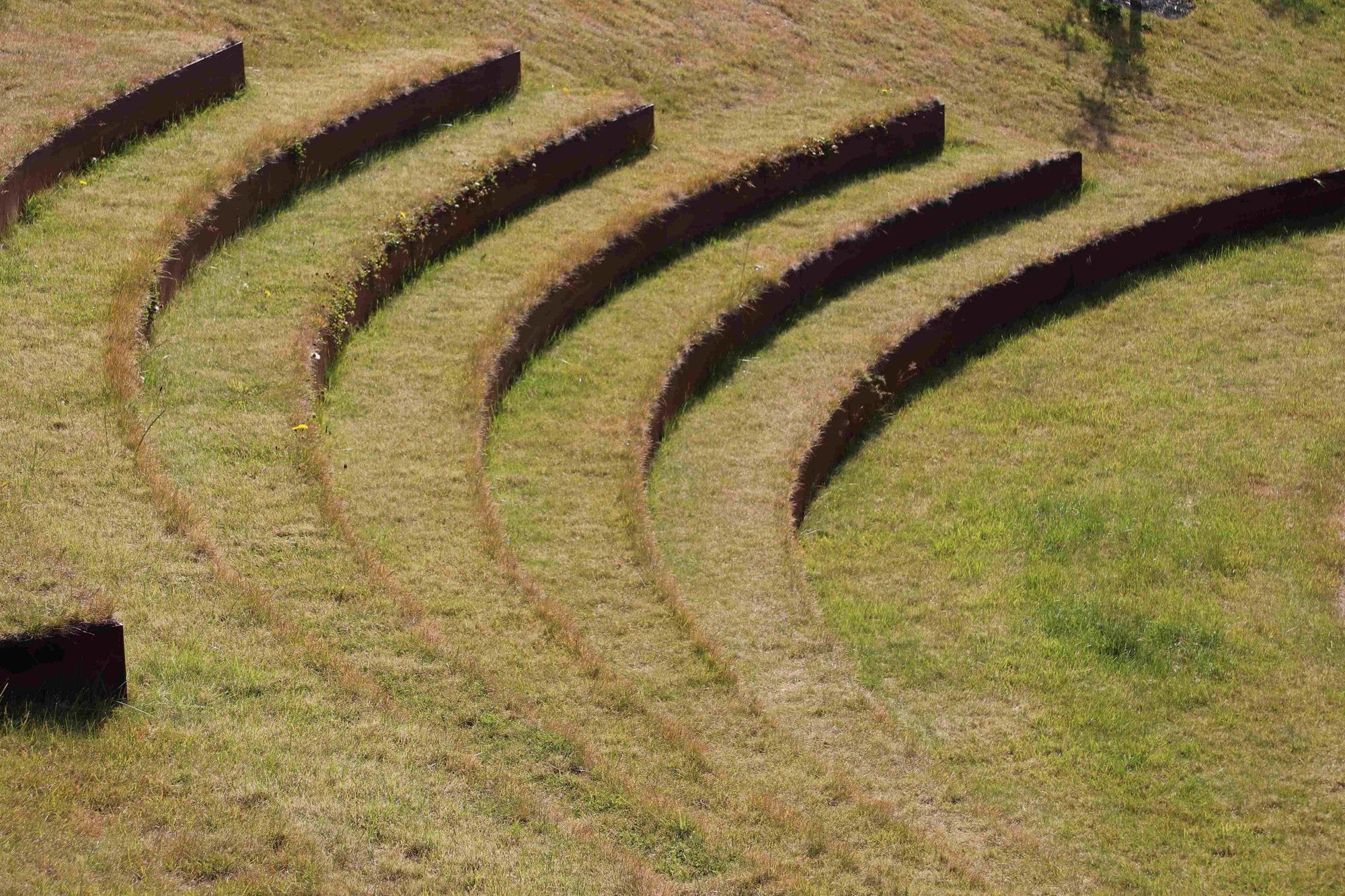 Curved and terraced grass hill