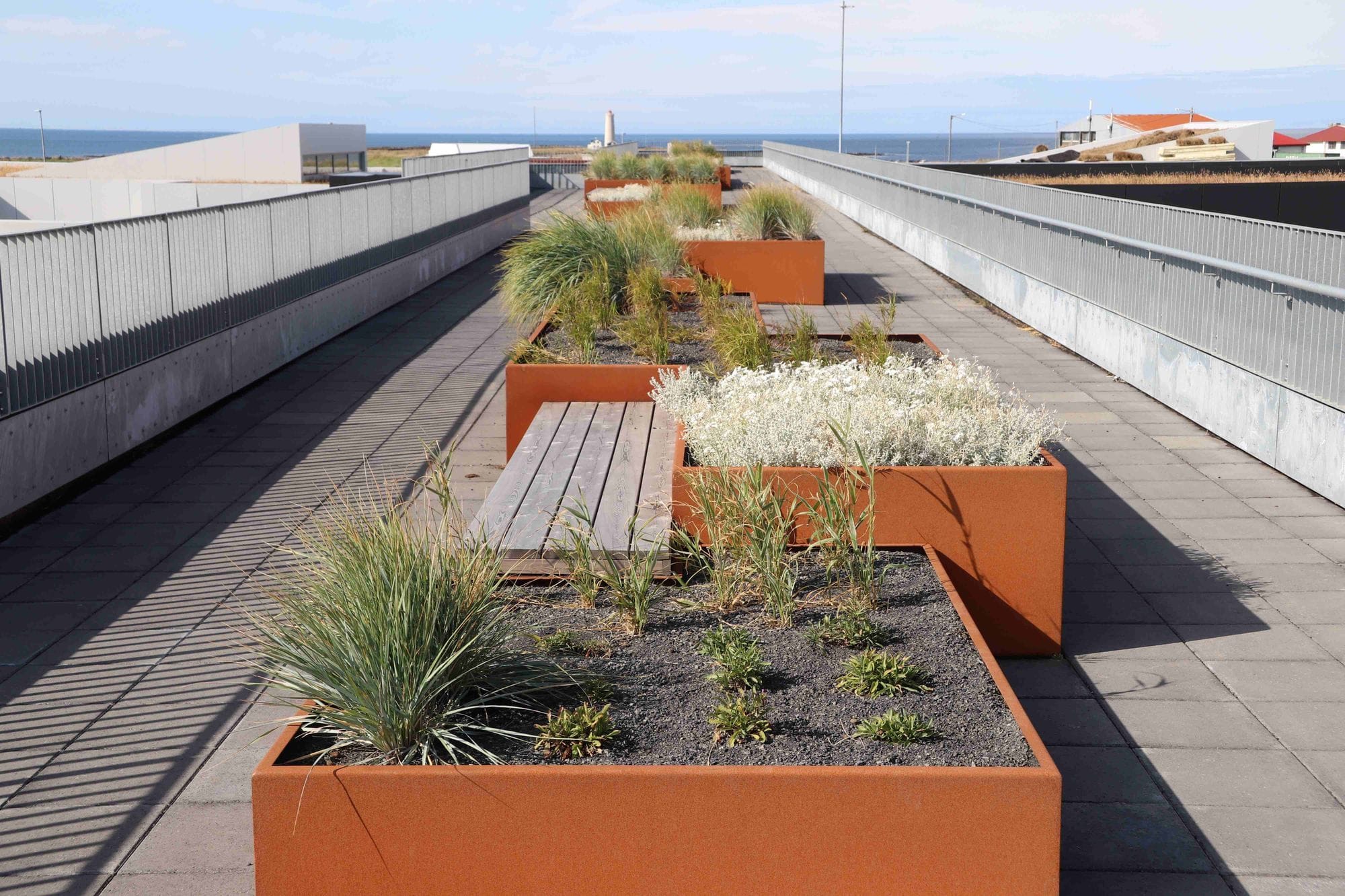 Benches and rusty vegetation boxes